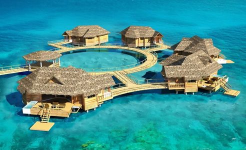 Illustratie voor: Droom Weg Met Deze Beelden Van de Eerste Caribische ‘Over-Water’ Suites