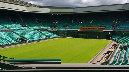 Het gras van Wimbledon in Londen, waar de prijzen voor VIP-plaatsen aardig de pan uit rijzen